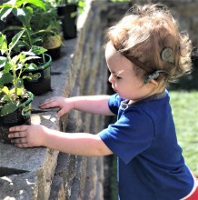 Toddler wearing cochlear implant