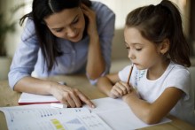 Parent and child working on schoolwork