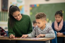 Student and teacher in classroom setting