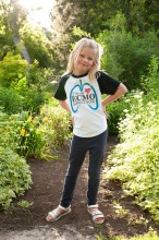 Young girl posing in greenery