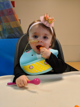 Child with NG tube, feeding herself