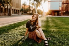 Teen girl sitting in the grass
