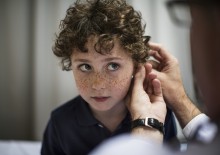 Boy getting his ears checked