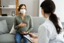 Pregnant woman meeting with provider