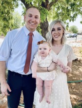 Family of 3 poses in front of tree