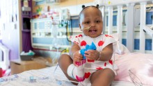 Toddler in hospital bed