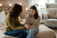 Teen holding mothers hands