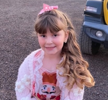 Girl in pink sweater