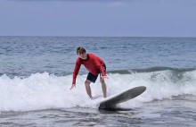 Teen boy surfing