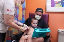 Child in parents lap with distraction