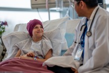 Doctor with child at bedside
